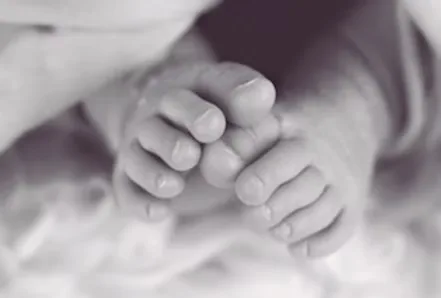 Close-up of tiny newborn toes